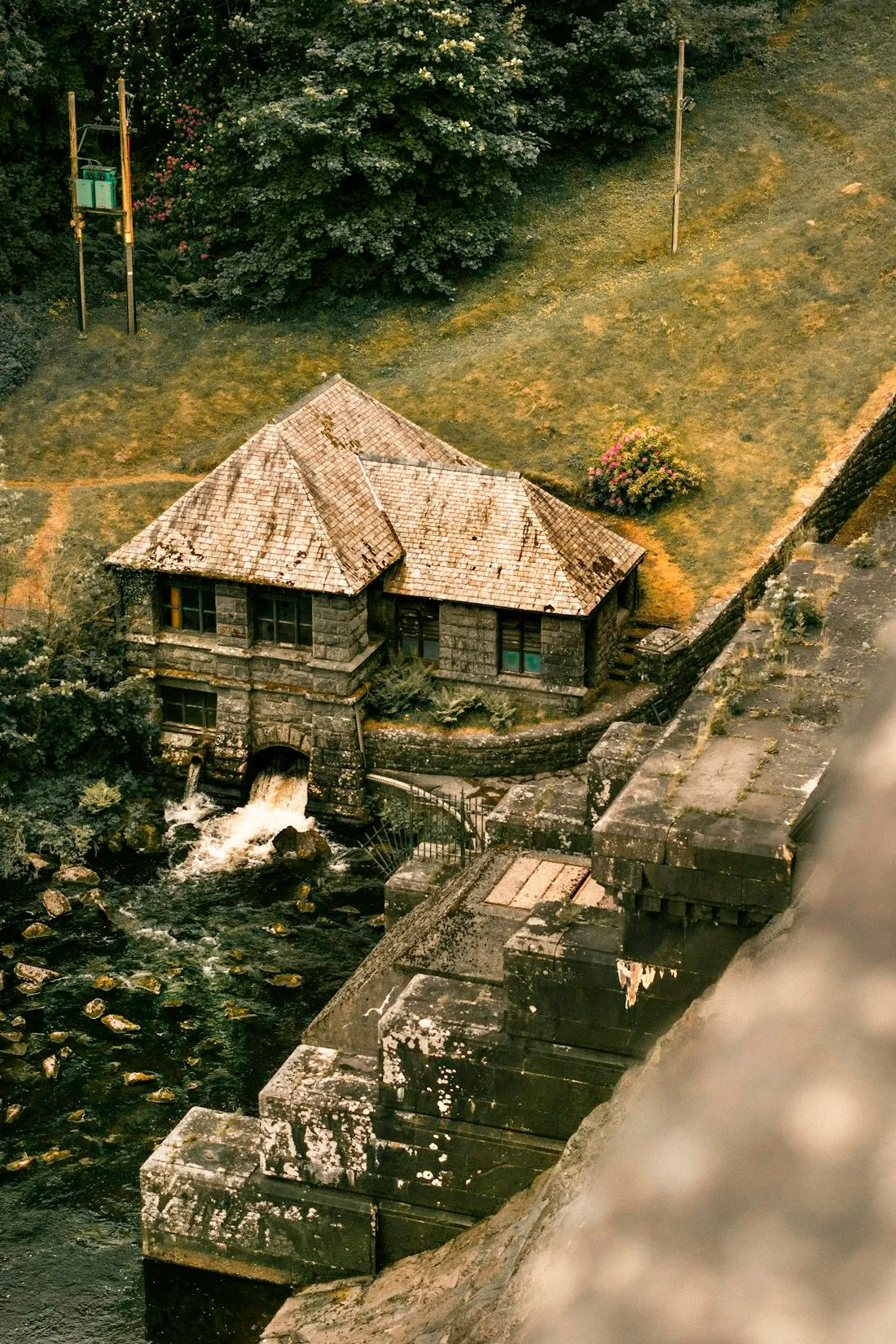 A traditional Welsh stone house beside a stream